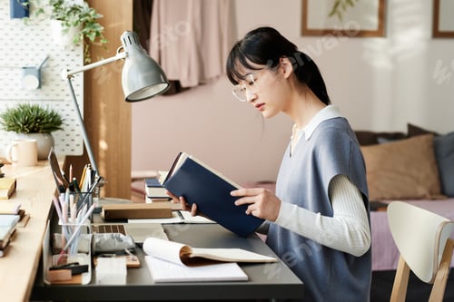 Preview: Concentrated Asian student preparing for exam