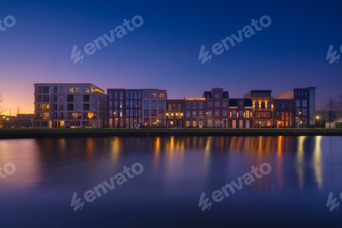 Preview: A cityscape during sunset. A apartment building near the water in the bay. Architecture.