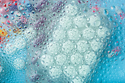 Preview: pill tablet capsule medicine through water drops background