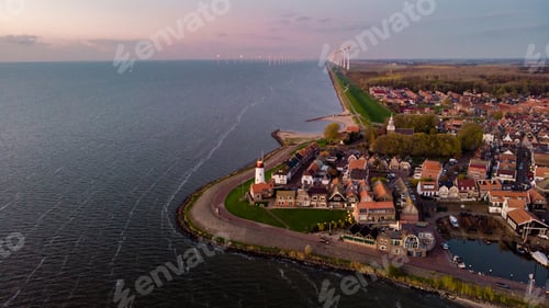 Preview: Urk Flevoland Netherlands sunset at the lighthouse and harbor of Urk Holland. Fishing village Urk