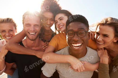 Preview: Portrait Of Smiling Young Friends Walking Outdoors Together