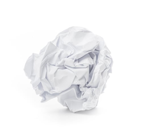Preview: Crumpled white paper ball on a clean surface with soft light illuminating its texture
