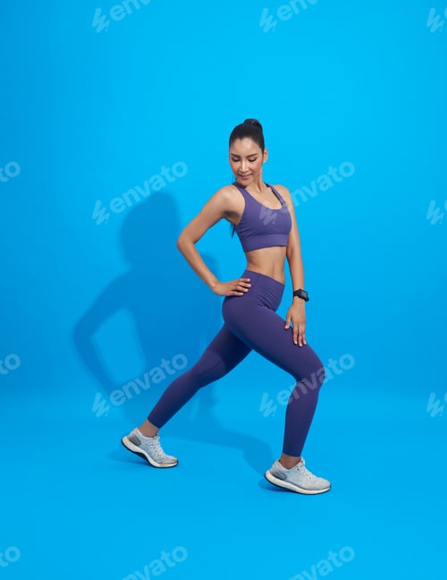Preview: Asian Fitness sporty girl doing stretching workout. Full length shot of young woman warm up exercise