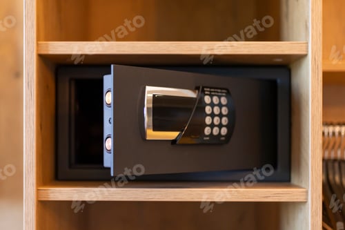 Preview: A secure safe featuring a digital keypad is displayed open within a wooden closet