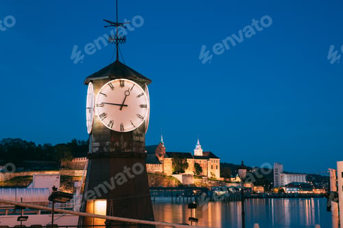 Preview: Oslo. Norway. Old Clock at Aker Brygge In Oslo Embankment, Norway. Night View Of Famous And Popular