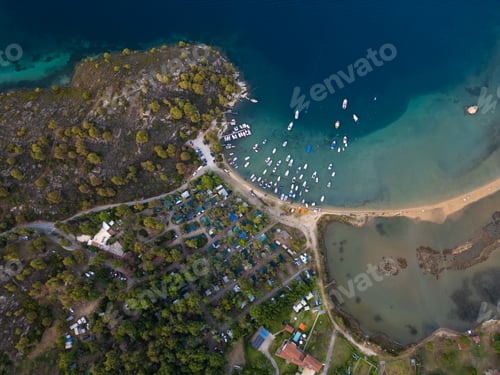 Preview: Aerial view of a vibrant marina in Sithonia, Greece, filled with various boats and yachts docked