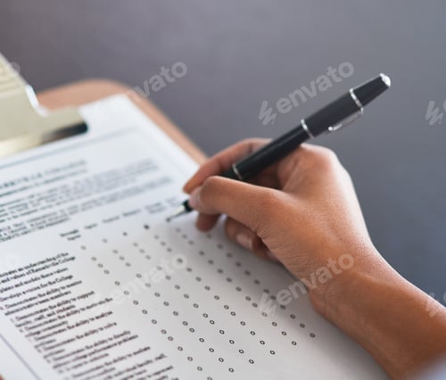 Preview: Completing the survey. Cropped shot of an unrecognizable businesswoman filling in a questionnaire.
