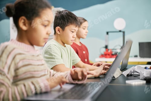 Preview: Children Using Laptops in Classroom for Learning