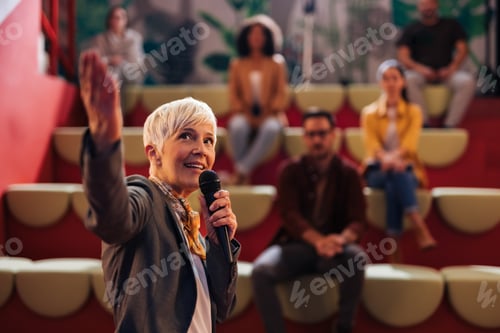 Preview: Businesswoman showing the presentation to the people in the public, learning something new.