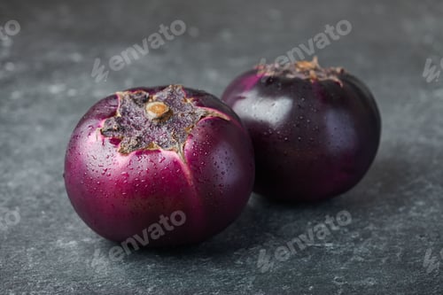 Preview: Two round purple eggplants