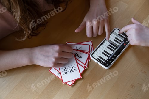 Preview: Close-up of cards for studying music and piano in the phone.