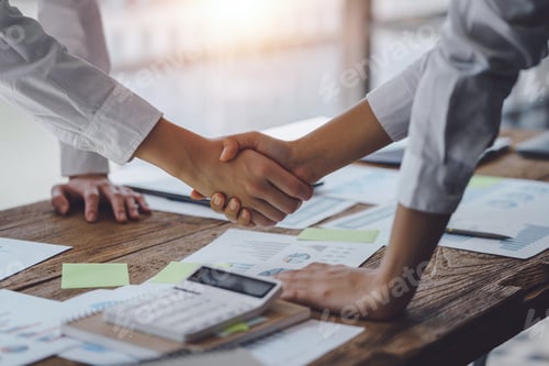 Preview: Business success. Business people shaking hands agreement confirmed in the investment business.