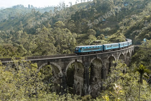 Preview: Beautiful shot of a blue train on the Nine Arch Bridge in Sri Lanka