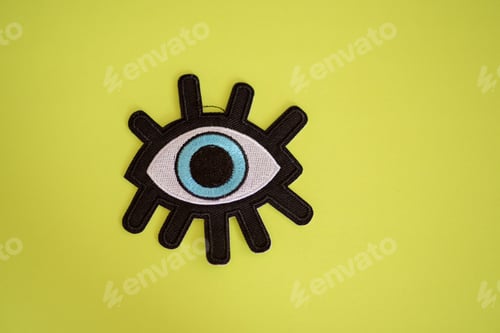 Preview: Eye patch isolated against yellow background