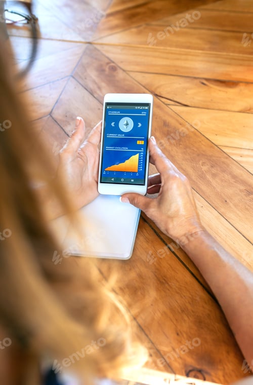 Preview: Businesswoman looking mobile with ethereum information