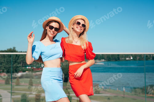 Preview: Smiling Women Posing in Sunny Urban Setting