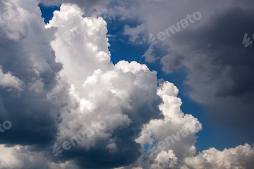 Preview: Amazing sky with puffy white and grey clouds.