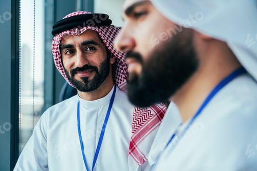 Preview: Arab businessmen discussing future strategies at a professional meeting