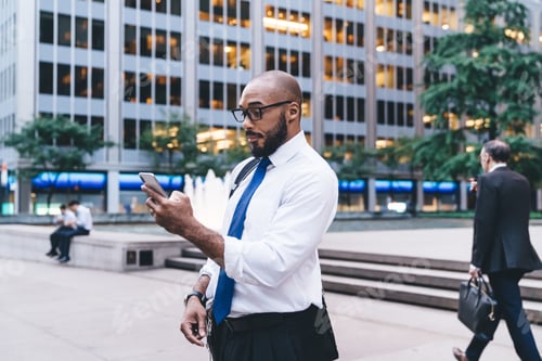 Professional Man Uses Smartphone in Urban Setting