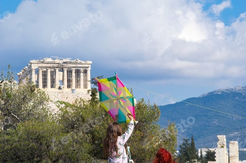 Preview: girl flies a kite on the Acropolis hill, Acropolis, Athens, Greece March 7, 2022