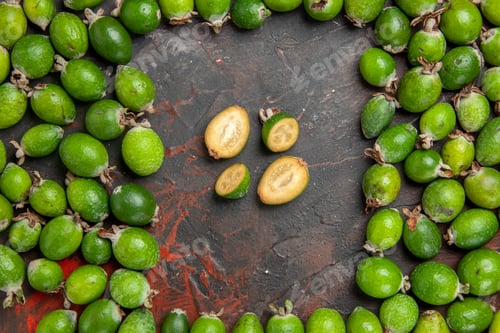 Preview: Overhead view fresh natural green feijoas small vitamin bomb on mixed color background