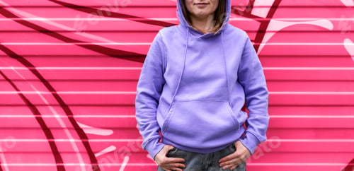 Preview: smiling Young woman in hood purple hoodie on pink background viva magenta color and very peri mockup