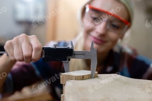 Preview: Close up vernier calipers. Worker carpenter or craftsman using vernier calipers measuring dimensions