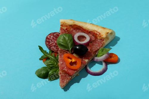 Preview: Slice of Salami pizza on blue background