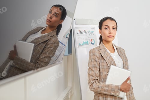 Preview: Mixed Race Businesswoman Posing in Office