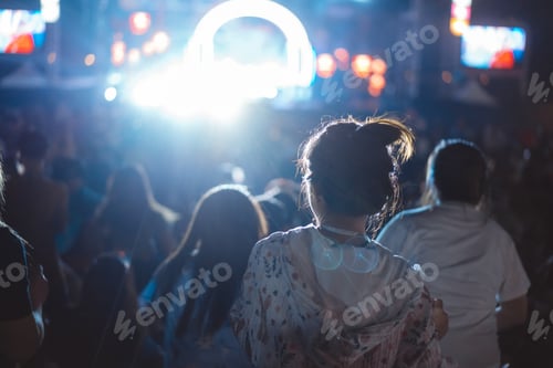 Preview: Audience enjoying live music at outdoor concert venue