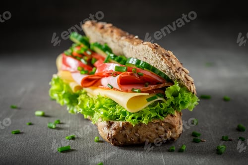 Preview: Fresh roll with cheese, ham and cucumber for breakfast