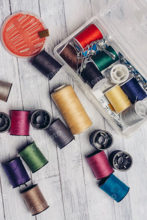 Preview: thread needles pins wooden background sewing accessories Copy Space