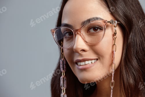 Preview: Portrait of a beautiful brunette woman in glasses close-up, attractive woman in stylish glasses on a