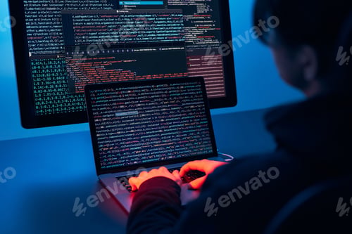 Preview: Man using computer and programming to break code. Cyber security threat. Network security