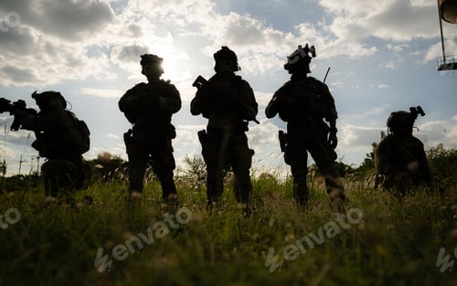 Preview: Soldier holding gun and showing action success or war win, special forces military training concept.