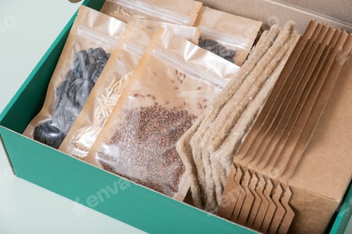 Preview: Set for growing sprouts from seeds. Seeds, linen mats, boxes and lids flat lay, top view