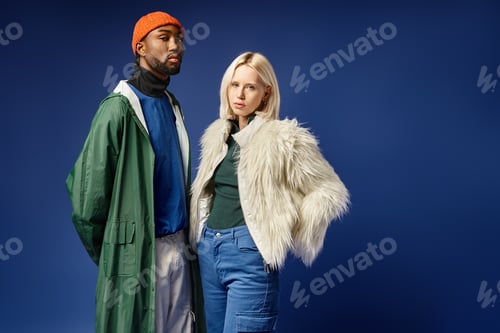 Preview: young multicultural couple, attractive woman in faux fur jacket and handsome african american man