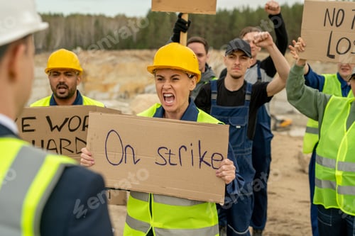 Preview: Furious female and other quarry workers carrying placards