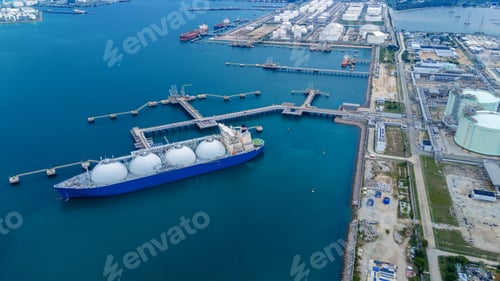 Preview: LNG (Liquified Natural Gas) tanker anchored in Gas terminal gas tanks for storage. Oil C