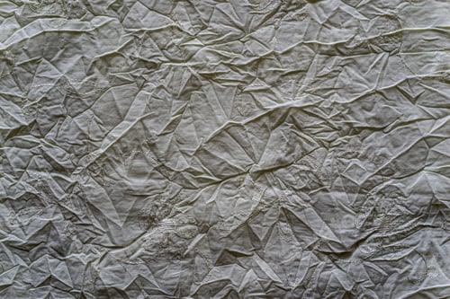 Preview: The Textured Background Of Graphite Color Of Crumpled Fabric From Textile Material