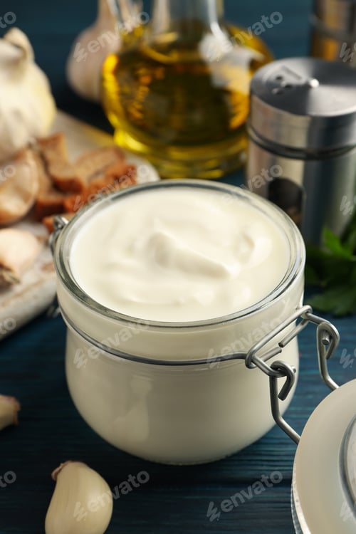 Preview: Concept of cooking garlic sauce on wooden background