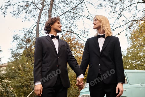 Preview: Two young men share a moment of love in a lush outdoor setting under soft autumn light