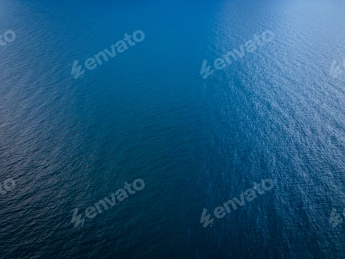 Preview: Aerial view of the sea surface reflecting the sky