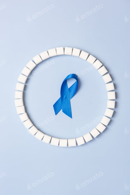 Preview: World Diabetes Day conceptual background, blue ribbon and sugar cubes ring
