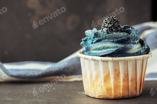 Preview: Blackberry Topped Cupcake with Dark Blue Frosting
