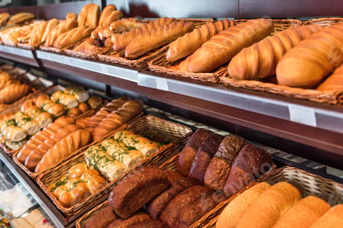 Preview: selective focus of freshly baked various bread in pastry department of grocery store
