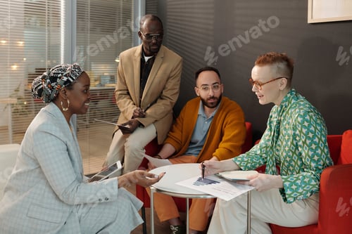 Preview: Diverse Team Collaborating on Business Project in Office