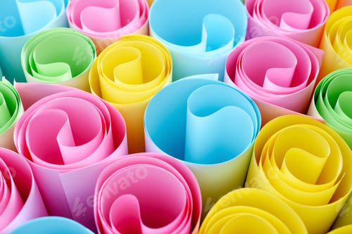 Preview: Colorful paper in rolls. Rainbow abstract background