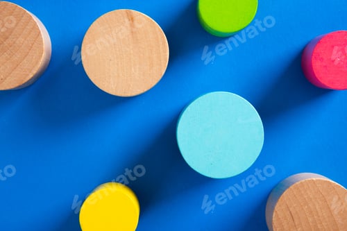 Preview: Colorful wooden pieces representing business strategy on blue background