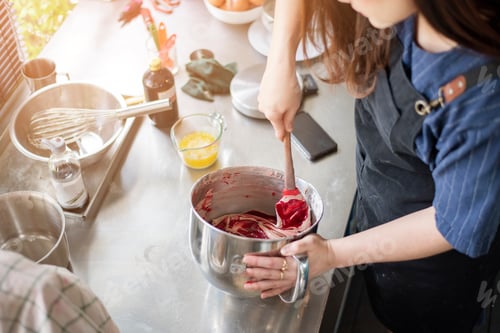 Woman Mixing Ingredients in Stainless Steel Bowl